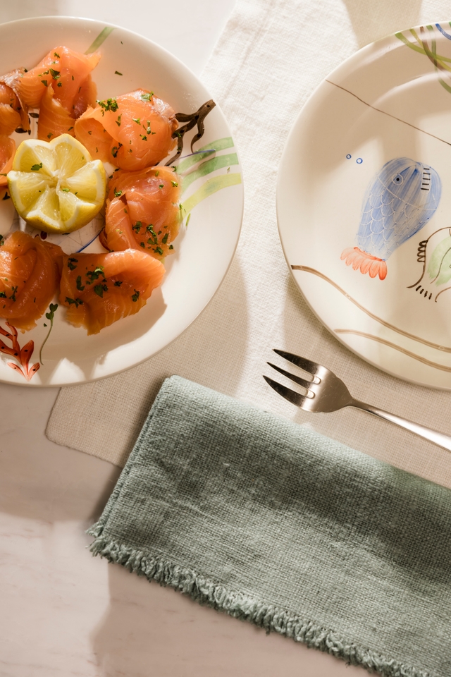 Folded linen napkins on a plate