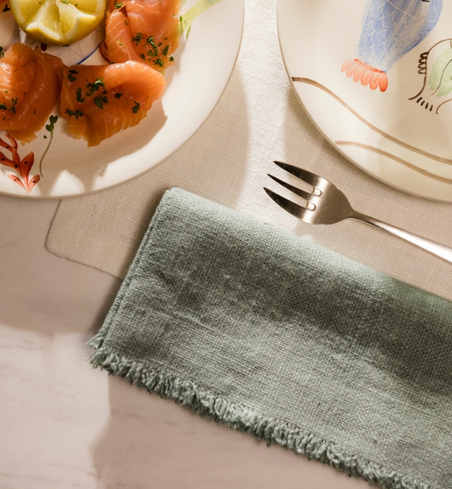 Folded linen napkins on a plate
